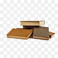 棕色散落四周的堆起来的书实物