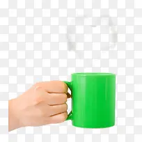 绿色冒热气茶杯