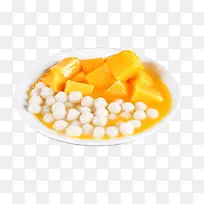 白盘子里的芒果小圆子甜品