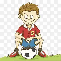 草地上坐着足球的小男孩